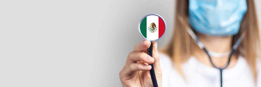 female doctor in a medical mask holds a stethoscope on a light background. Added flag of Mexico. Concept medicine, level of medicine, virus, epidemic. Baner female doctor in a medical mask holds a stethoscope on a light background. Added flag of Mexico. Concept medicine, level of medicine, virus, epidemic. Baner